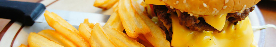 Eating Burger at Burger Lounge restaurant in La Jolla, CA.